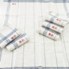 torchon en lin bleu monogrammé
