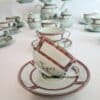 Superbe service à thé en porcelaine de Limoges, vert céladon , maison Raynaud , décor floral , 27 pièces.